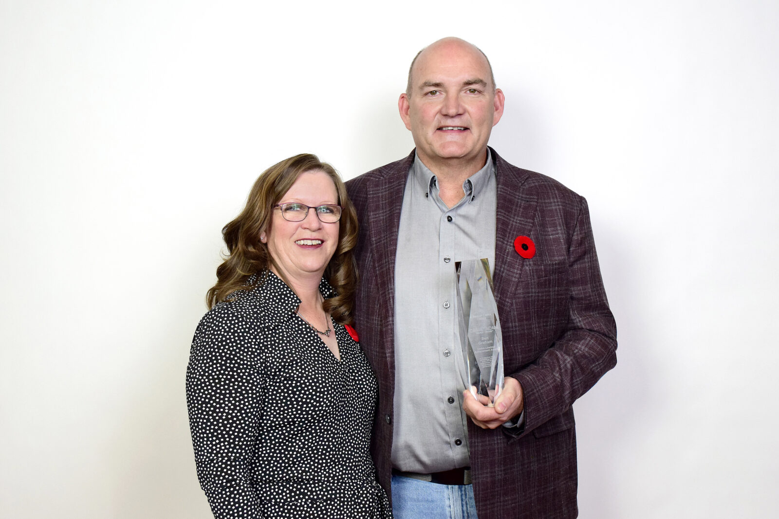 holly nicol and ben graham with lifetime achievement award