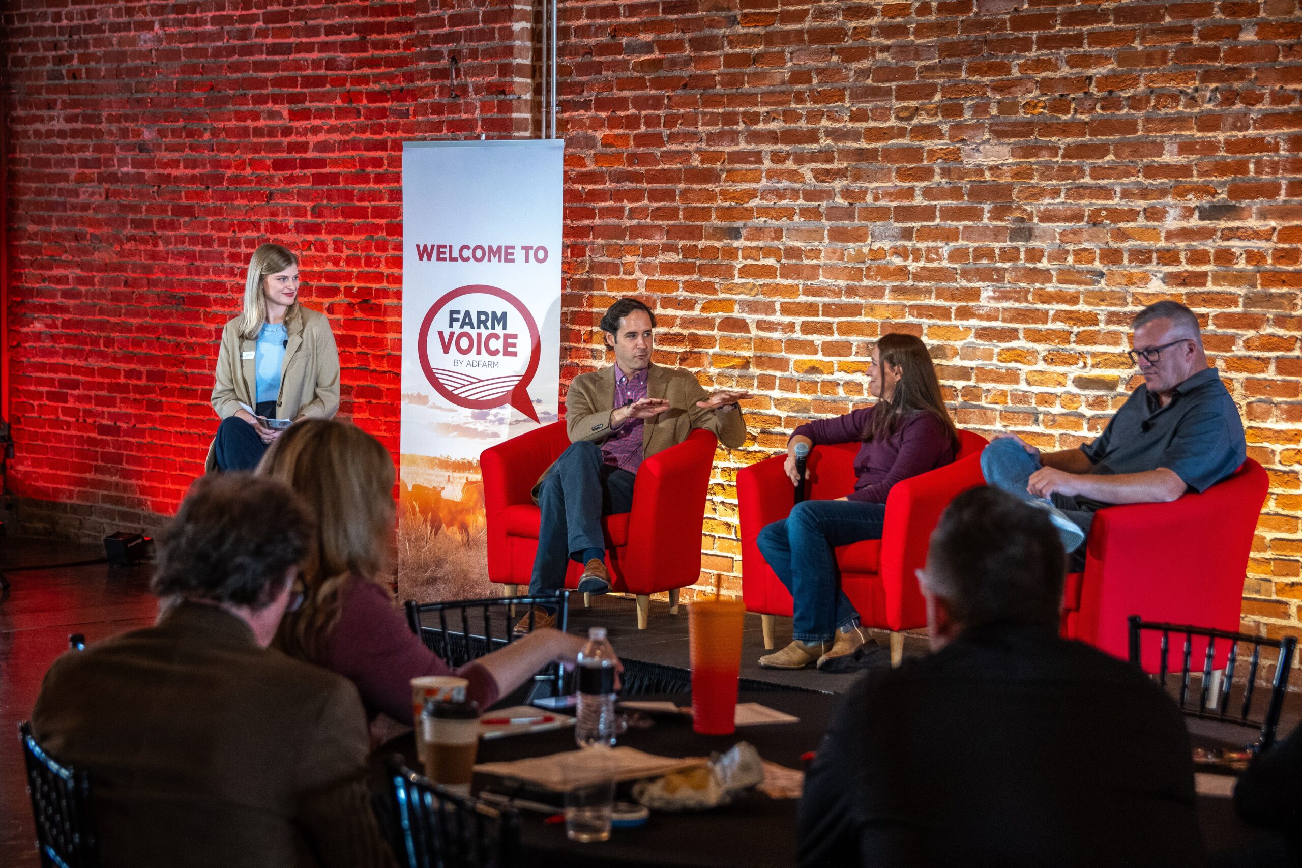 A row of speakers conversing about agricultural innovation topics; 2 females and 2 males