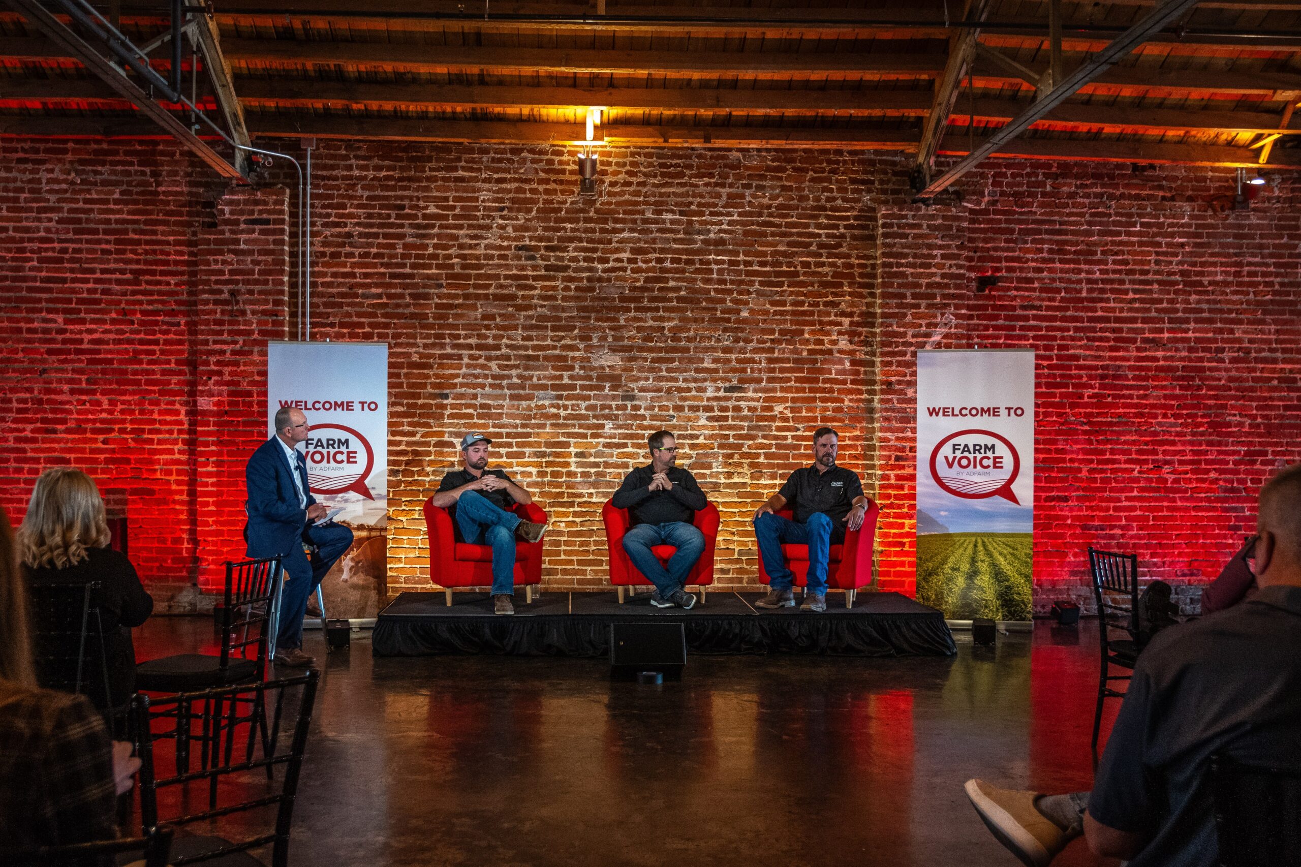 A panel of four men sitting to discuss topics on agricultural connectivity